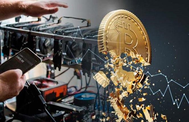 A miner inspecting mining hardware